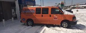 Water Damage Restoration Van In Snow At Commercial Job Site